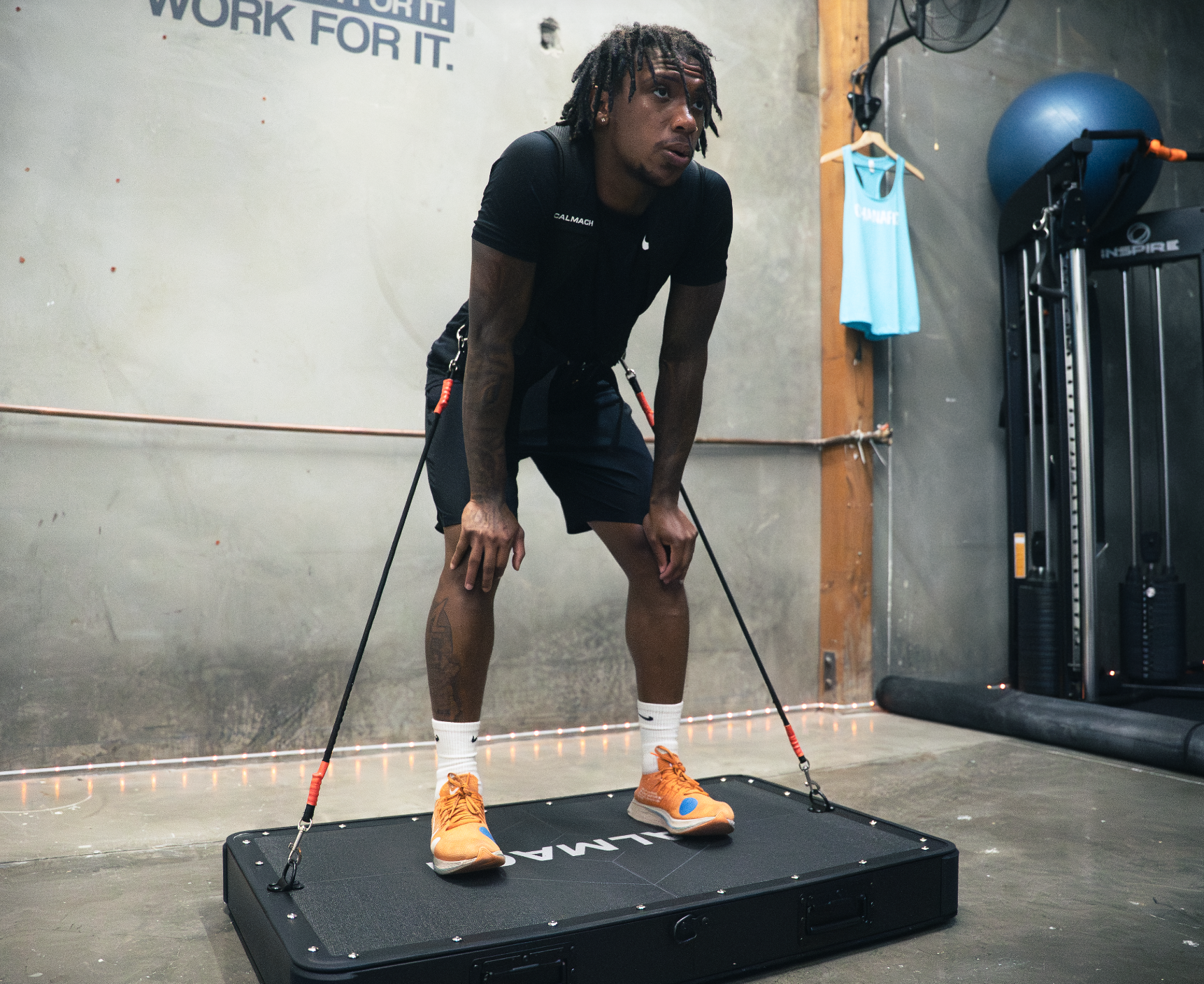 Athlete standing on Calmach board